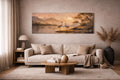 May include: A long, rectangular canvas print showing a tranquil landscape with two cranes by a lake. The artwork uses a warm palette of beige, brown, and orange, with a sunset and mountains in the background. The print is displayed above a beige sofa