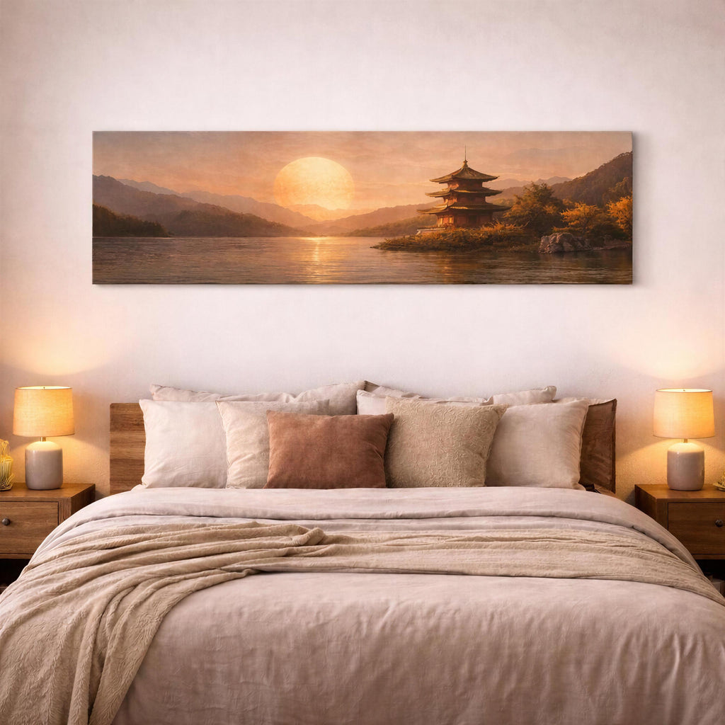 May include: Panoramic canvas art print depicting a serene Japanese landscape. The artwork features a multi-tiered pagoda on a small island, a large setting sun, and mountains reflected in the water. The color palette is warm, with shades of orange, brown, and gold.